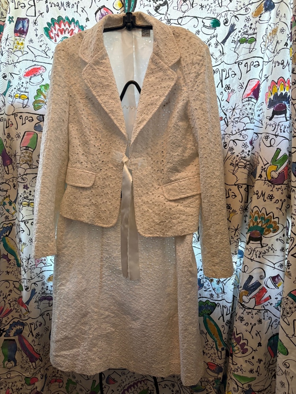 Malcolm & Co eyelet structures suit.